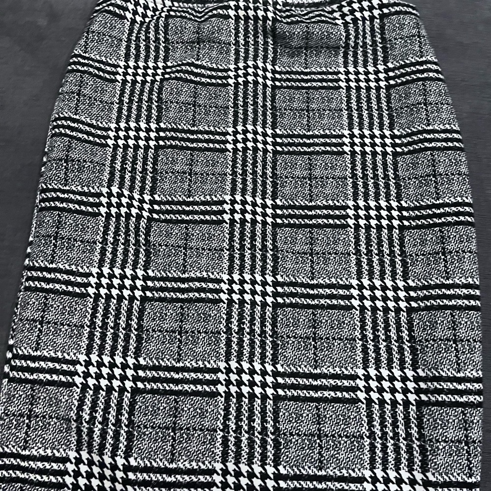 Black and white plaid skirt. Stretchy material knee length.